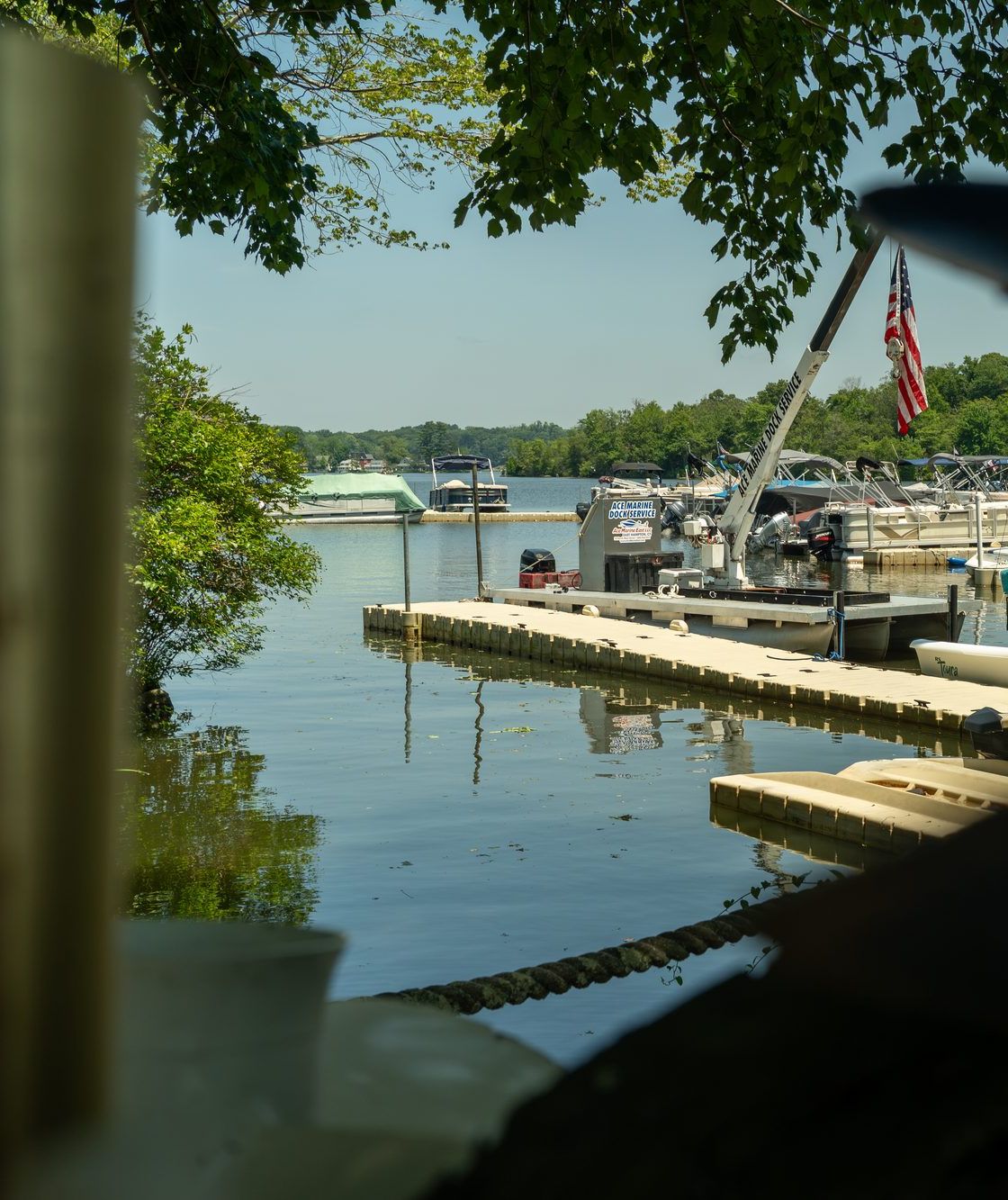 Boats in slips at Ace Marine East on Lake Pocotopaug